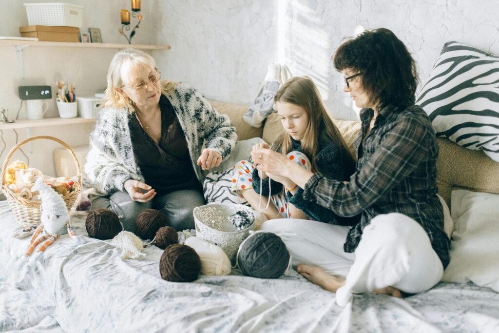 Three people crocheting together,sharing creativity and connection.