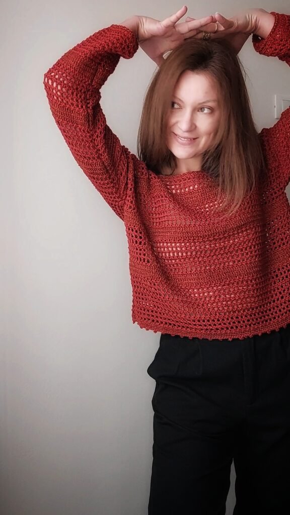 Handmade striped crochet sweater in Tunisian stitch, worn on a summer day