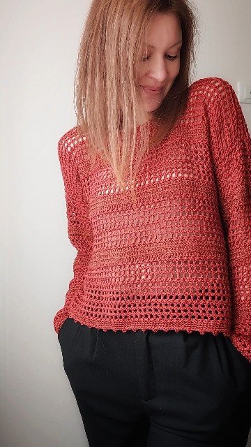 Handmade crochet sweater with openwork stripes in natural yarn, displayed on a model wearing it with a relaxed, minimalist look.