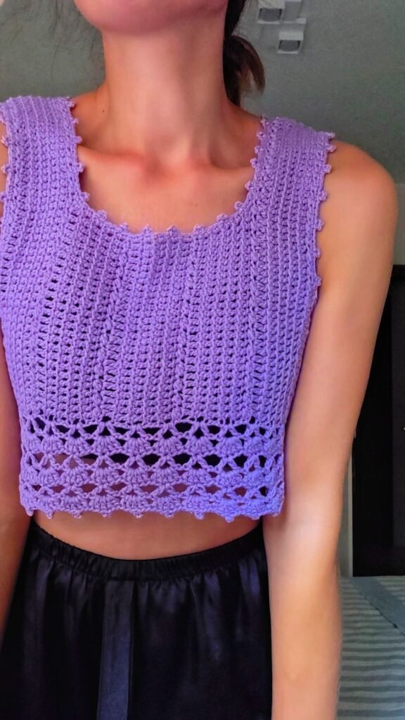 Lilac cotton crochet crop top with open stitch detail.