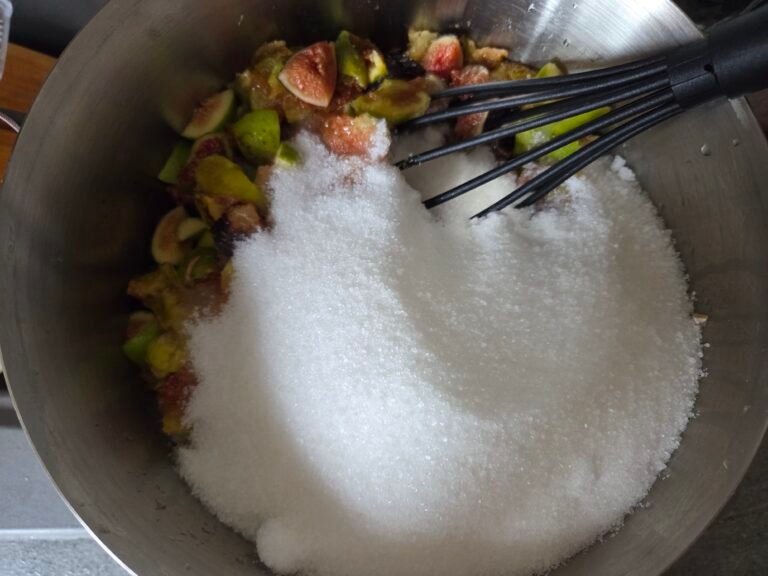 Figs in a pot with sugar and lemon juice for jam making.