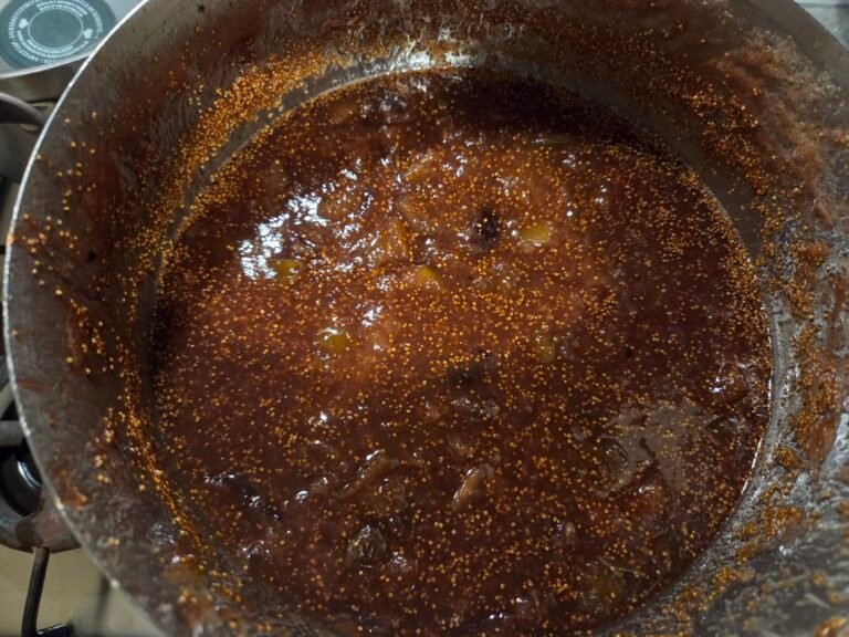 Cooked figs in a pot, transformed into jam.