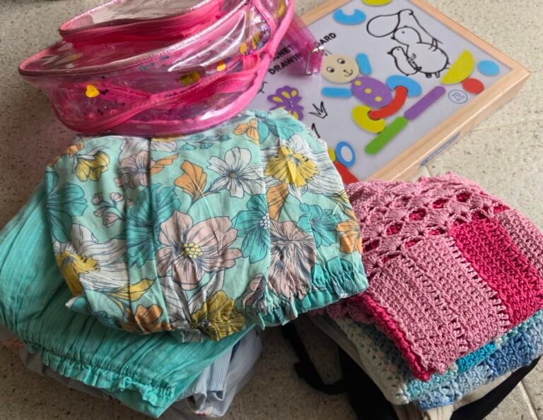 Decluttering and giving away children's clothes.