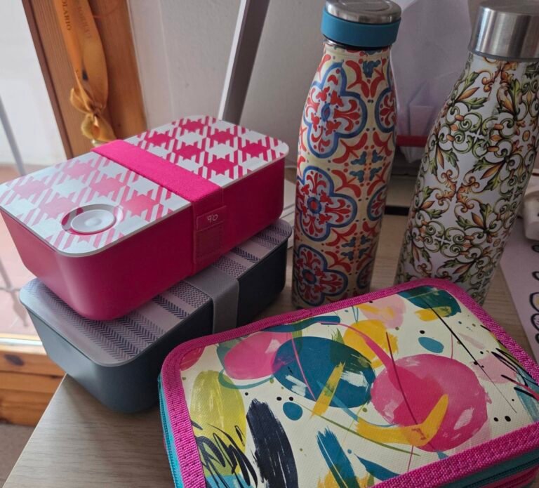 Preparing school supplies with lunch bag, pencil case, and backpack.