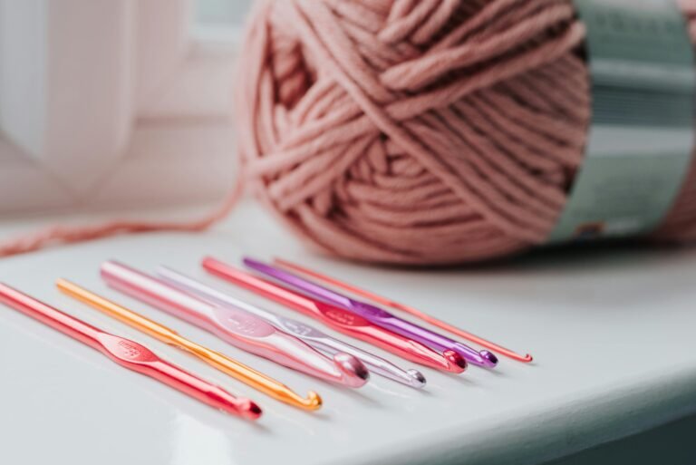 Different crochet hook sizes arranged together, showing how to match hooks with yarn for perfect stitches.